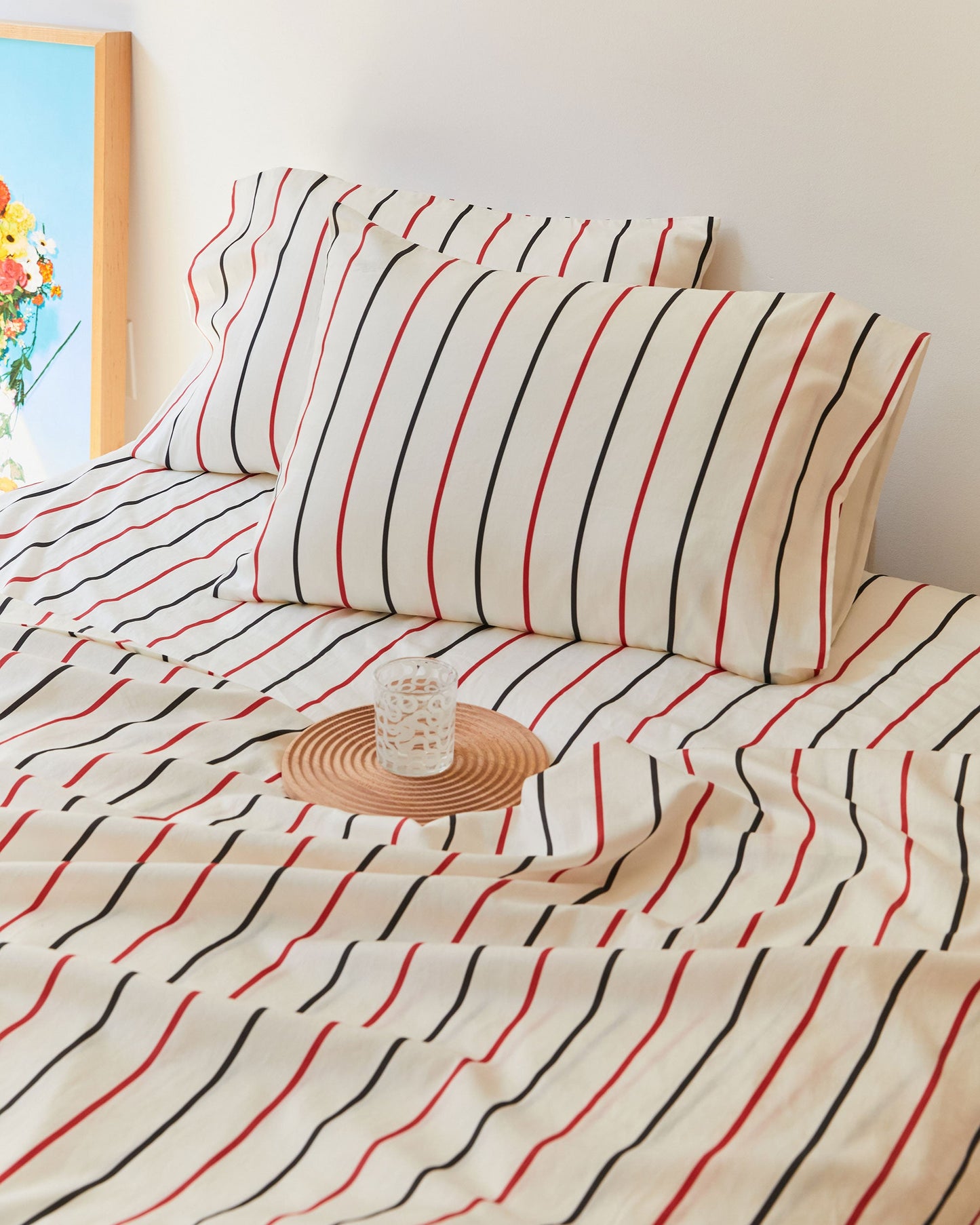 Dusen Dusen Lowlands Stripe Sheets. Sheeting in white, black and red stripes. 100% cotton sateen, 300 thread count. Machine wash cold and tumble dry. Made in Portugal. Our cotton sateen is smooth and cool to the touch and features a slightly lustrous finish.; Wrap yourself up in a stripe, for a cozy sleep so nice. Close your eyes to blow off steam, I will be there in your dream.