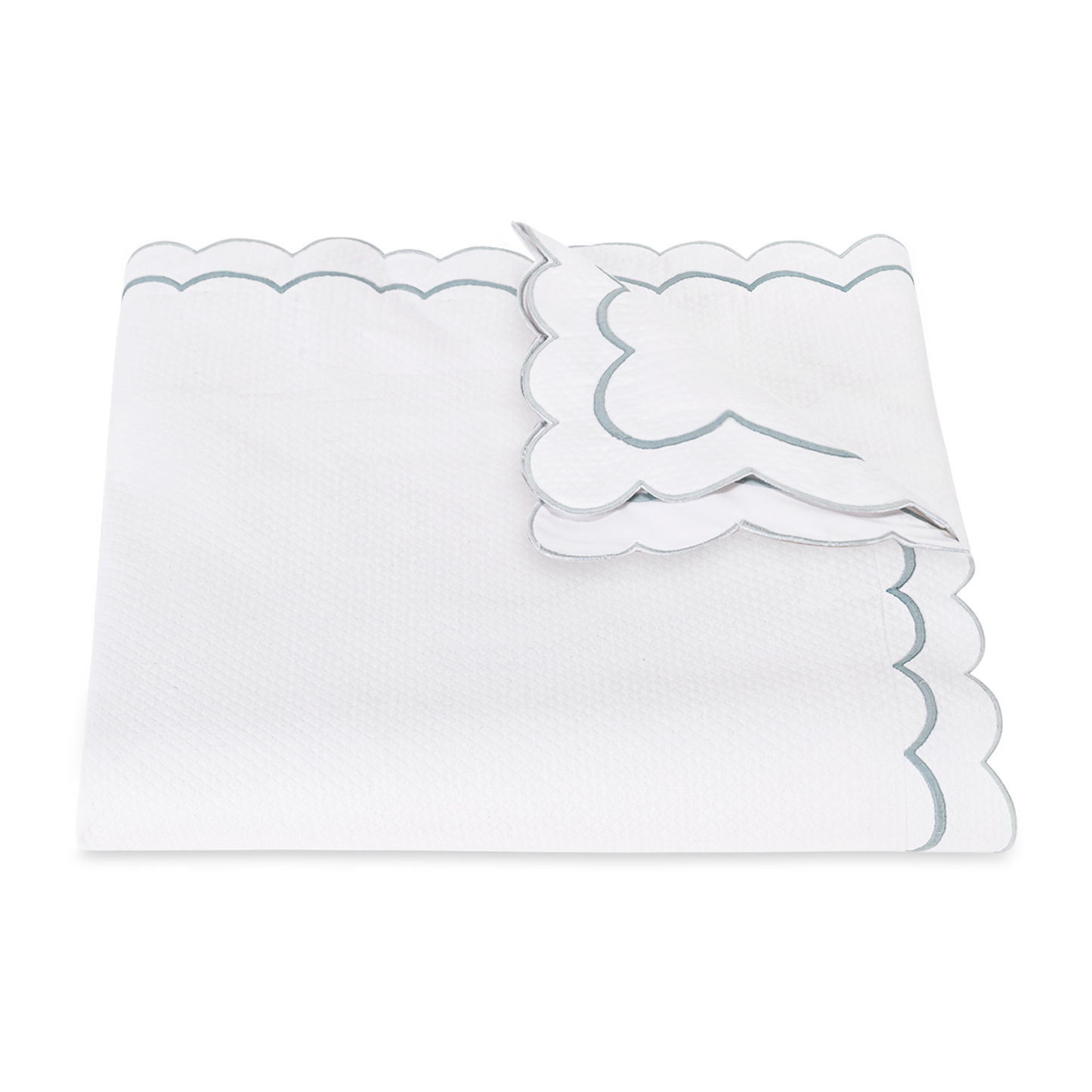 View of a Folded Matouk India Pique Bedding Duvet Cover in Pool Color
