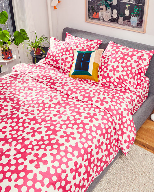 Dusen Dusen Atom Bedding. Duvet and Sheet Sets in raspberry and white Atom print. Include an individual Flat Sheet to round out a Sheet Set. 100% cotton sateen, 300 thread count. Machine wash cold and tumble dry. Made in Portugal. Our cotton sateen is smooth and cool to the touch and features a slightly lustrous finish.; Less splitting the atom, more sleeping in it! <br> FINAL SALE <br> Up to 50% Off