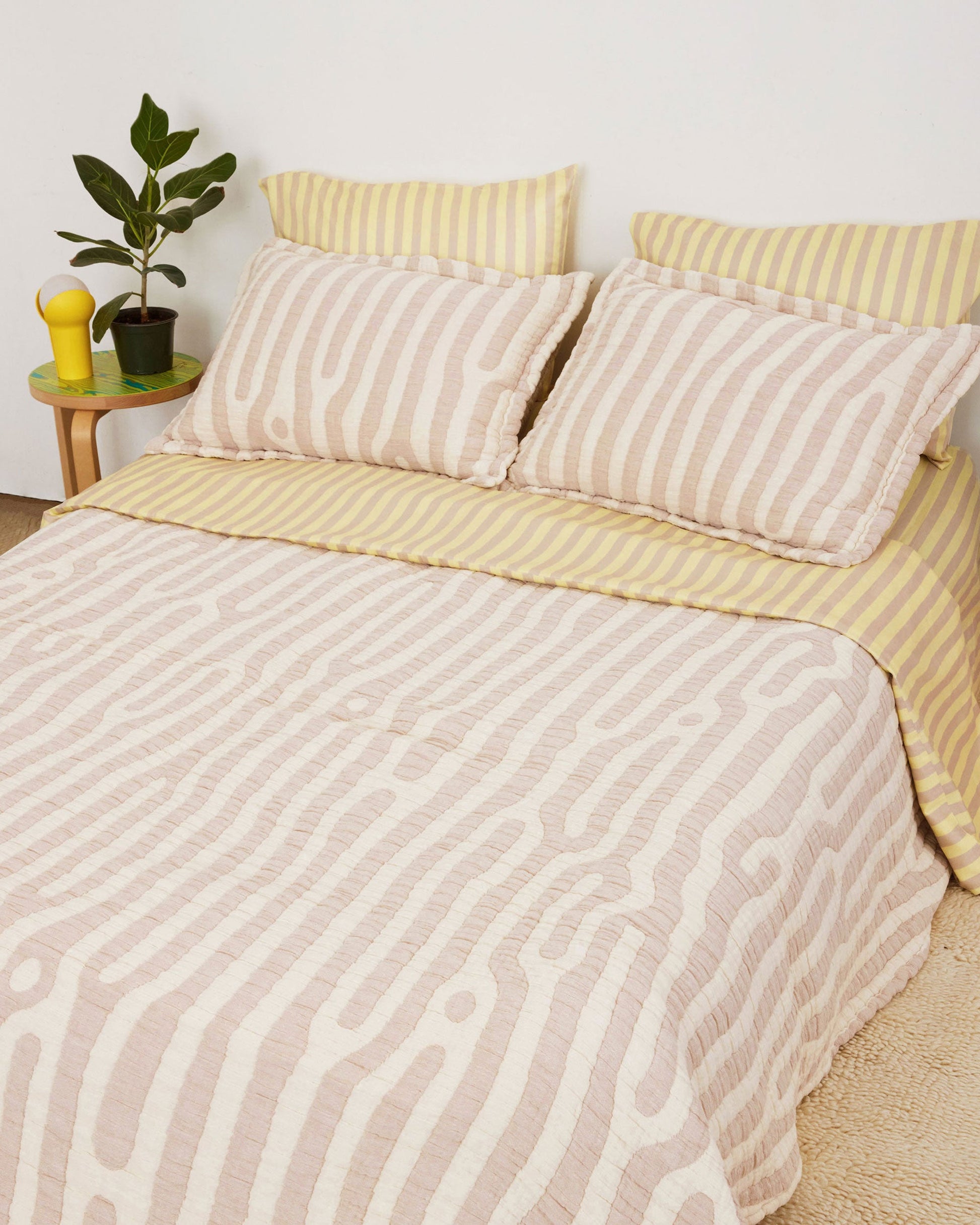 Birch Coverlet Set in tan and cream Birch print. Stone-washed, woven matelassé coverlet with an inner layer of insulation for a quilted effect. Extra soft and gauzy hand feel. 100% cotton shell, polyester fill. Made in Portugal.; Birch, please. You know you need this coverlet.