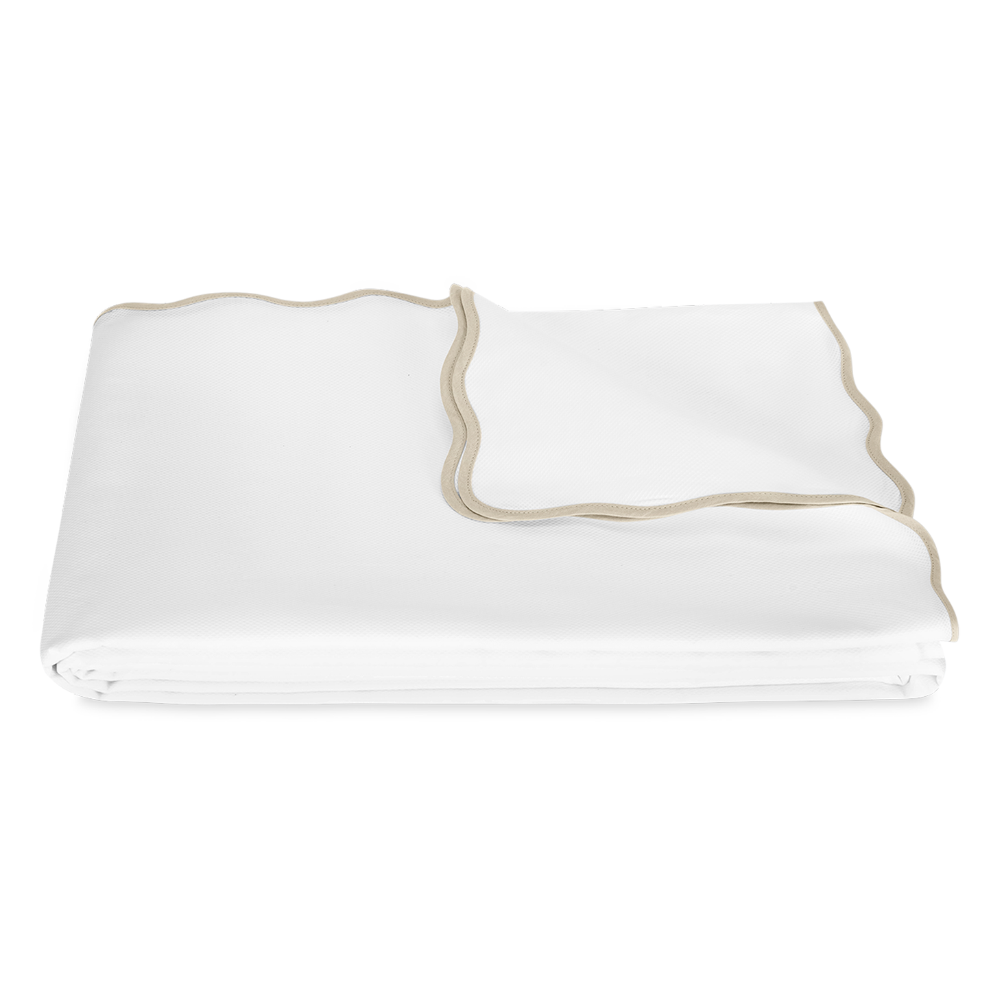 Folded Coverlet of Matouk Camilla Pique Bedding in Color Dune