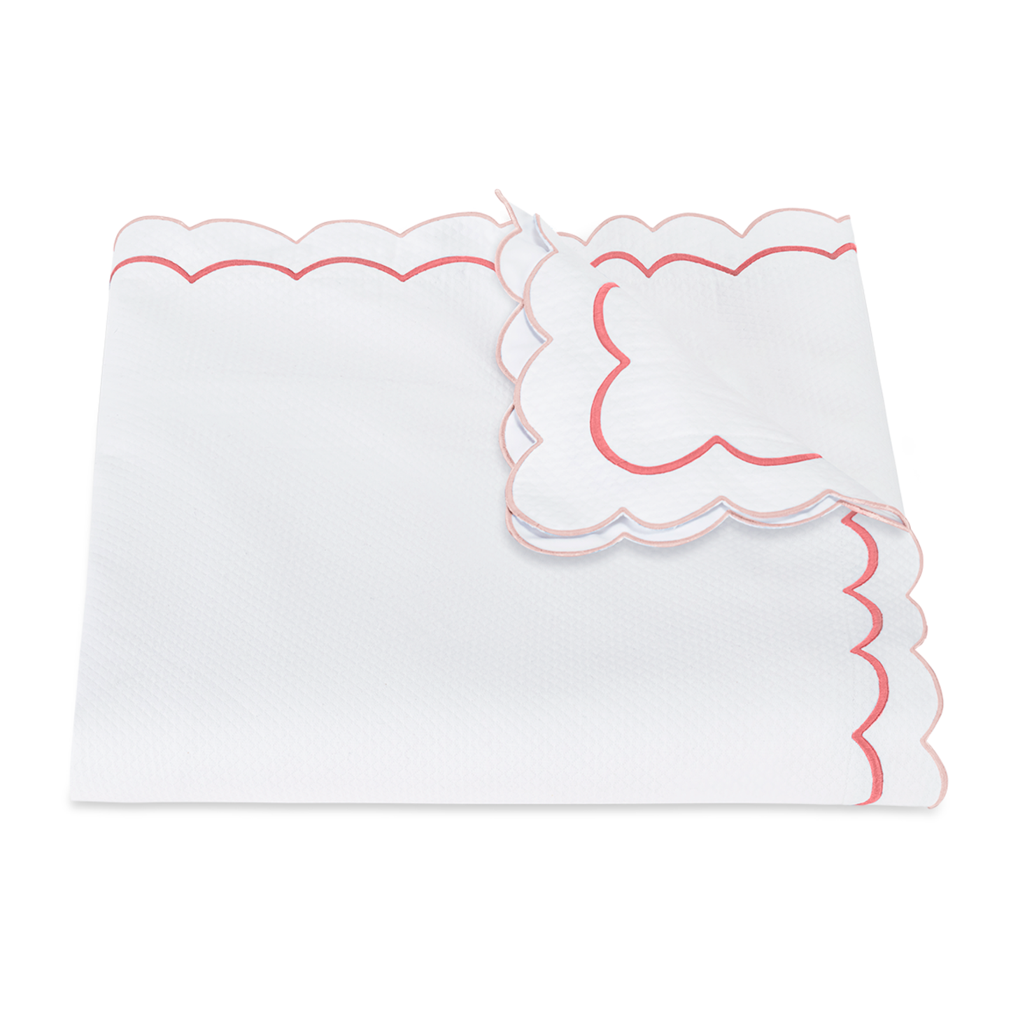 View of a Folded Matouk India Pique Bedding Duvet Cover in Blush Color