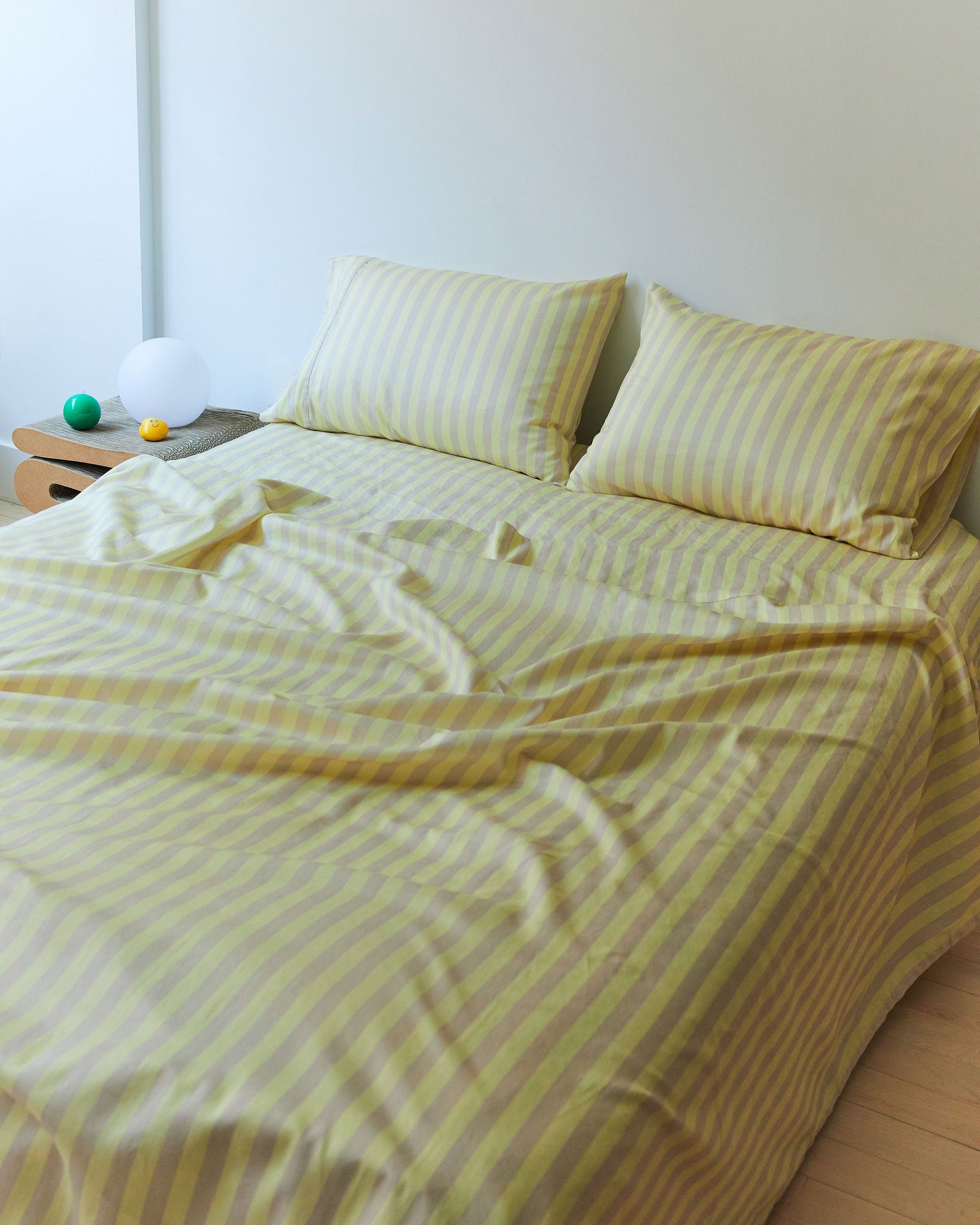 Dusen Dusen Sand Stripe Sheets. Flat Sheet and Sheet Sets in tan and yellow stripes. 100% cotton sateen, 300 thread count. Machine wash cold and tumble dry. Made in Portugal. Our cotton sateen is smooth and cool to the touch and features a slightly lustrous finish.; Ever go to sleep in the desert? This is like that except for less camels.