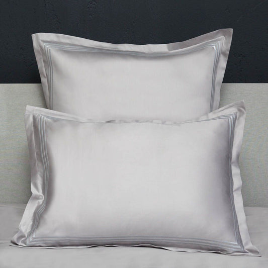 Closeup View of Signoria Platinum Sateen Shams in White/Wilton Blue Color