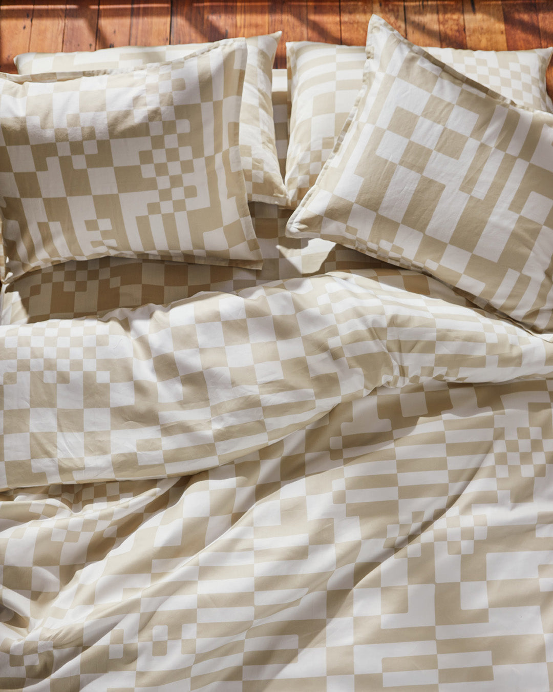 Dusen Dusen Check Duvet and Sheet Sets. Duvet and Sheet Sets in beige and white Check print. Include an individual Flat Sheet to round out a Sheet Set. 100% cotton sateen, 300 thread count. Machine wash cold and tumble dry. Made in Portugal. Our cotton sateen is smooth and cool to the touch and features a slightly lustrous finish; Our check bedding is going to make you want to check IN to your bedroom and OUT of whatever you were going to do today.