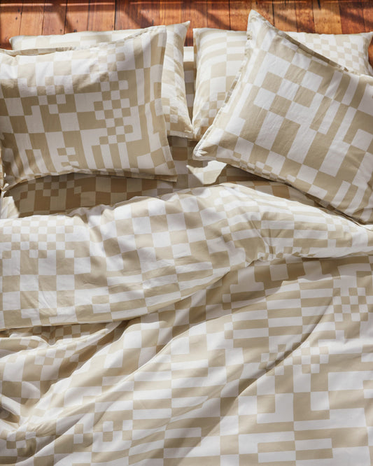 Dusen Dusen Check Duvet and Sheet Sets. Duvet and Sheet Sets in beige and white Check print. Include an individual Flat Sheet to round out a Sheet Set. 100% cotton sateen, 300 thread count. Machine wash cold and tumble dry. Made in Portugal. Our cotton sateen is smooth and cool to the touch and features a slightly lustrous finish; Our check bedding is going to make you want to check IN to your bedroom and OUT of whatever you were going to do today.